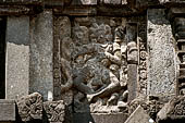 Prambanan - Candi Lara Jonggrang, miniature shrines surmounted by small fluted stupa with panels with musicians and dancers decorating the top of the balustrade 